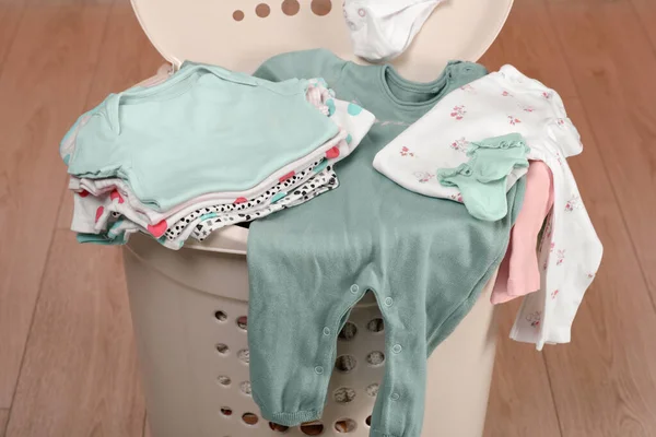 stock image Laundry basket with baby clothes indoors, closeup