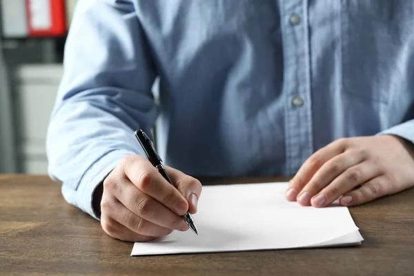 Man Writing Sheet Paper Pen Wooden Table Closeup — Stock Fotó