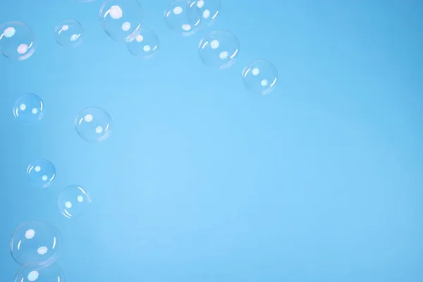 Many Beautiful Soap Bubbles Light Blue Background Space Text — 图库照片