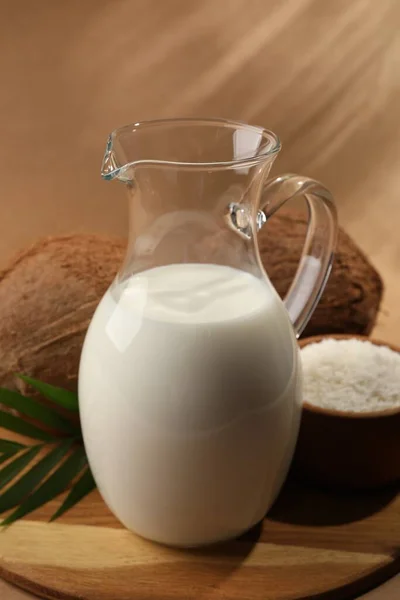 Glass Jug Delicious Vegan Milk Coconuts Brown Background — Zdjęcie stockowe