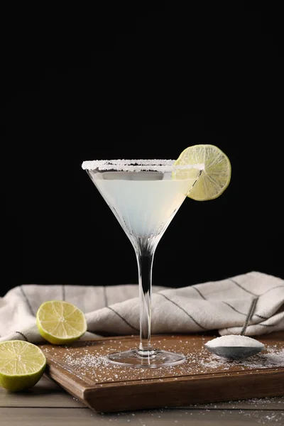 Martini Glass Refreshing Cocktail Lime Sugar Wooden Table Black Background — Stockfoto