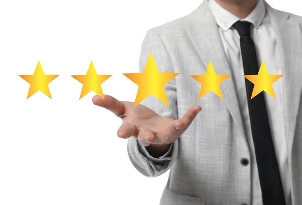 Quality Evaluation Businessman Showing Virtual Golden Stars White Background Closeup — Stock Fotó