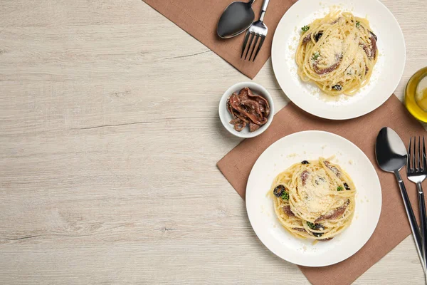 Delicious Pasta Anchovies Olives Parmesan Cheese Served Light Wooden Table — 스톡 사진