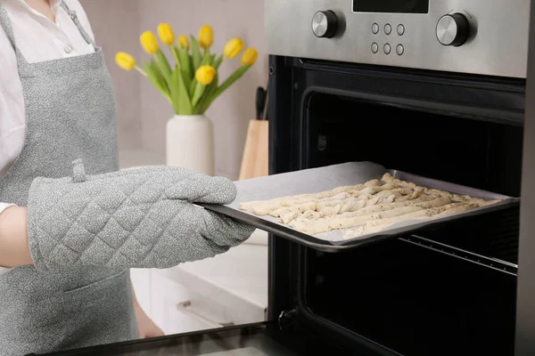 Woman Putting Baking Sheet Homemade Breadsticks Oven Kitchen Closeup Cooking —  Fotos de Stock