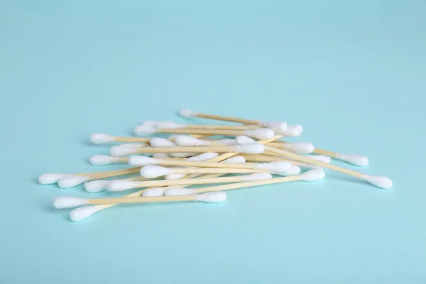 Wooden Cotton Buds Light Blue Background — стоковое фото