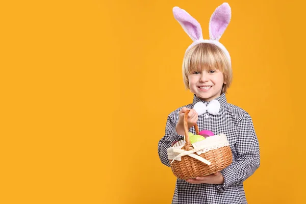 Happy Boy Bunny Ears Headband Holding Wicker Basket Painted Easter — Fotografia de Stock