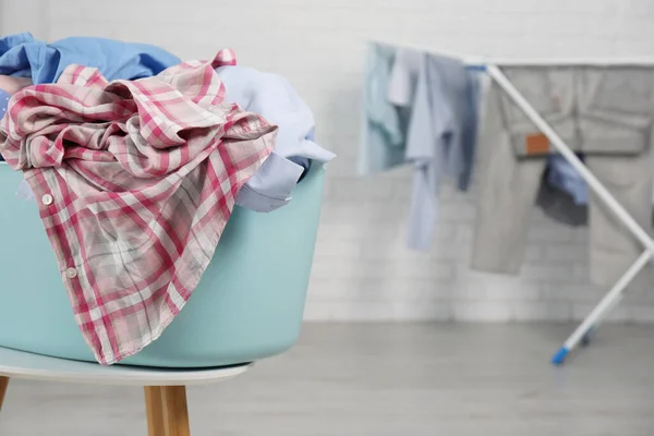 Plastic Laundry Basket Overfilled Clothes White Stool Indoors Space Text — Foto Stock