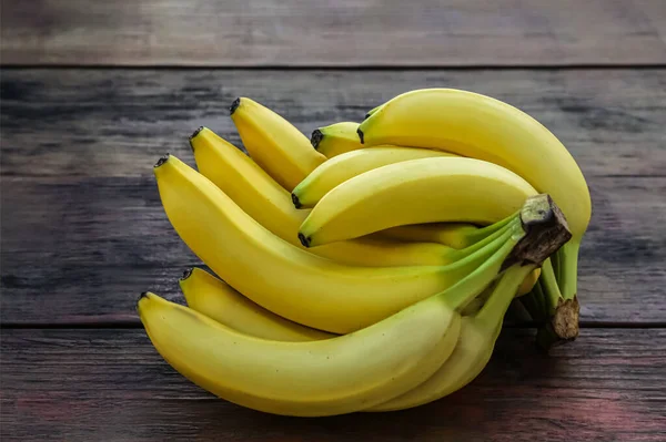 Bunches Ripe Yellow Bananas Wooden Table — Stock Photo, Image