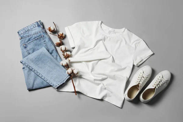 Stylish Shirt Jeans Sneakers Light Grey Background Flat Lay — Stock Photo, Image