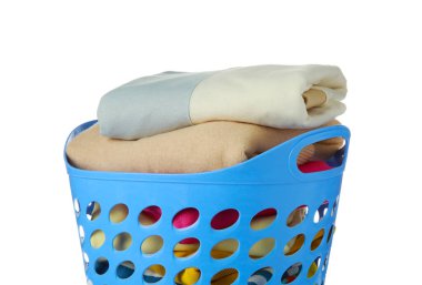 Blue plastic laundry basket with clean clothes isolated on white