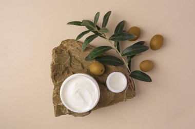 Flat lay composition with different natural cosmetic products on beige background