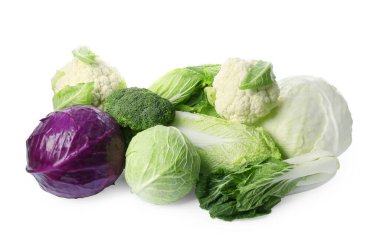 Many different fresh ripe cabbages on white background