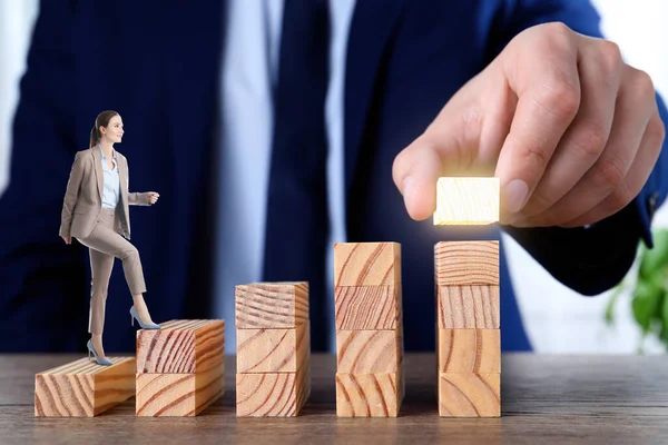 Steps to success. Businesswoman climbing up stairs of wooden blocks. Man adding height to staircase, closeup