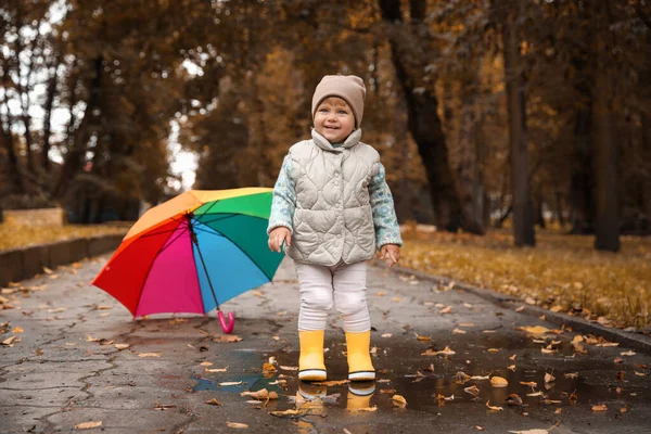 Cute Little Girl Standing Puddle Colorful Umbrella Outdoors — ストック写真