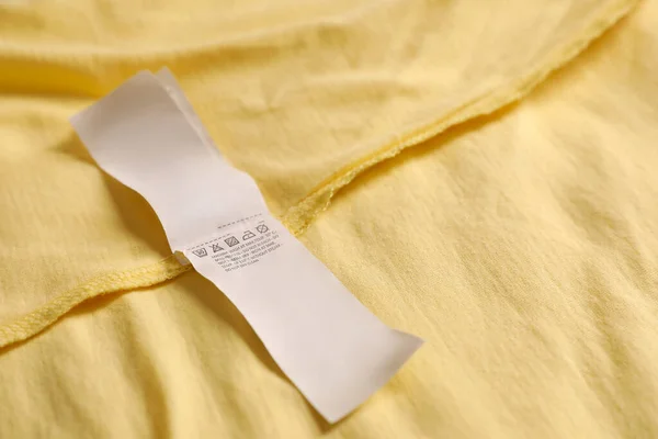 Clothing Label Beautiful Yellow Garment Closeup Space Text — Zdjęcie stockowe
