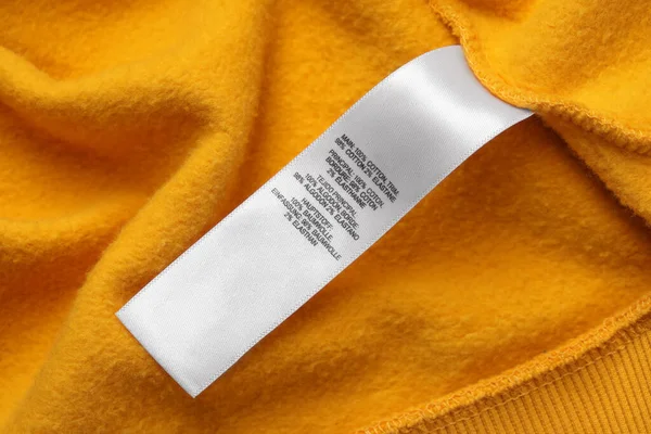 Clothing Label Recommendations Care Orange Garment Closeup — Foto Stock