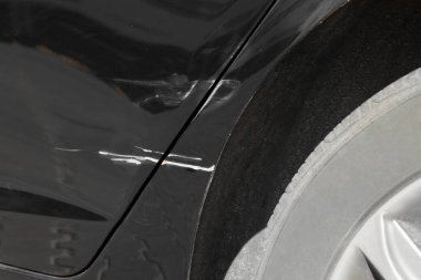 Modern black car with scratch, closeup view