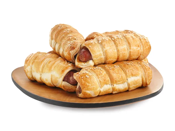 stock image Wooden tray with delicious sausage rolls isolated on white