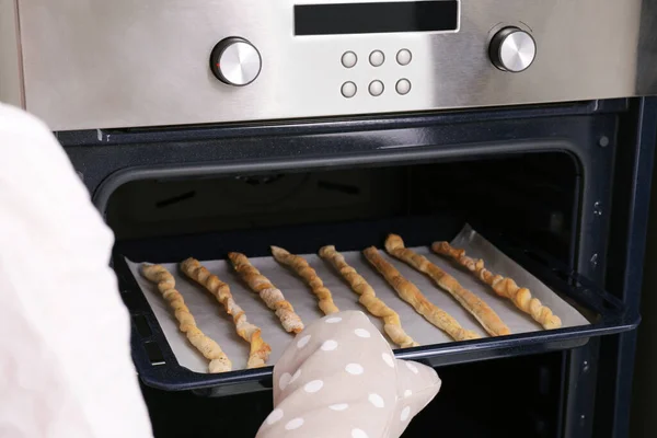 Woman Taking Baking Sheet Homemade Breadsticks Out Oven Closeup Cooking —  Fotos de Stock