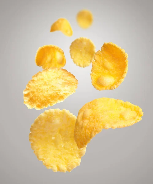 Vele Smakelijke Cornflakes Vallen Lichtgrijze Achtergrond — Stockfoto