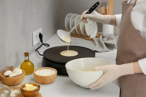 Woman Cooking Delicious Crepe Electric Pancake Maker White Marble Table — Stockfoto