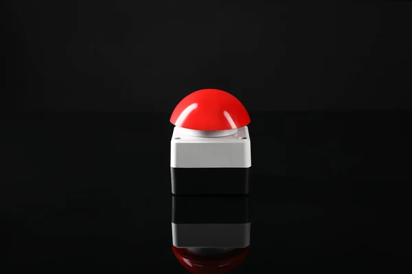 Red button of nuclear weapon on black background. War concept