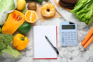 Food products, notebook with calculator on white marble table, flat lay. Weight loss and calorie counting concept clipart