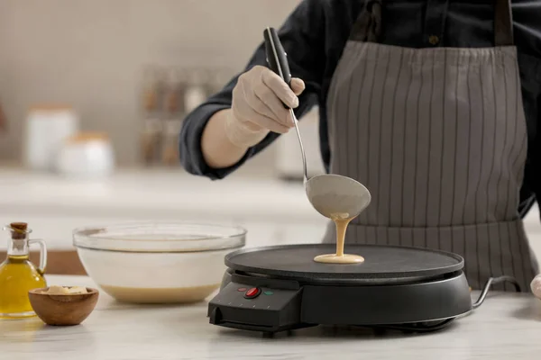 Woman Cooking Delicious Crepe Electric Pancake Maker White Marble Table — 스톡 사진