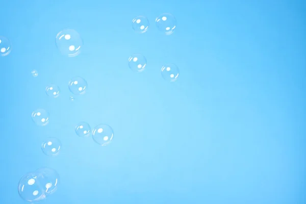 Many Beautiful Soap Bubbles Light Blue Background Space Text — Stockfoto