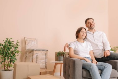 Happy couple in new apartment. Moving day