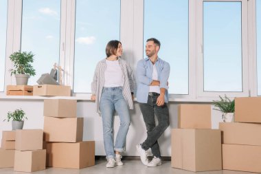 Happy couple in new apartment. Moving day