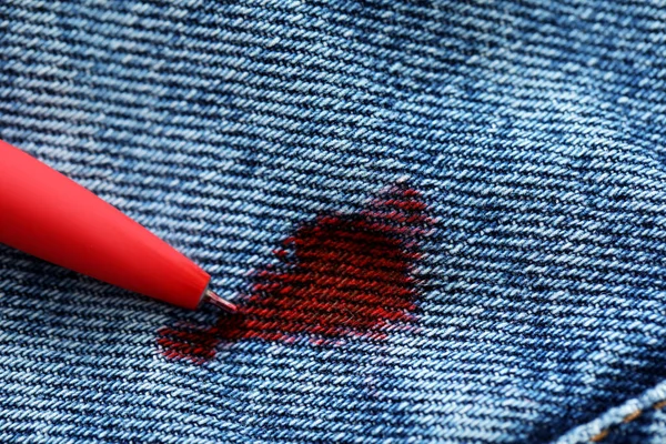 Pen Stain Red Ink Jeans Closeup — Fotografia de Stock