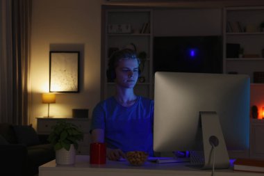 Genç çocuk geceleri yatak odasında bilgisayar kullanıyor. İnternet bağımlılığı