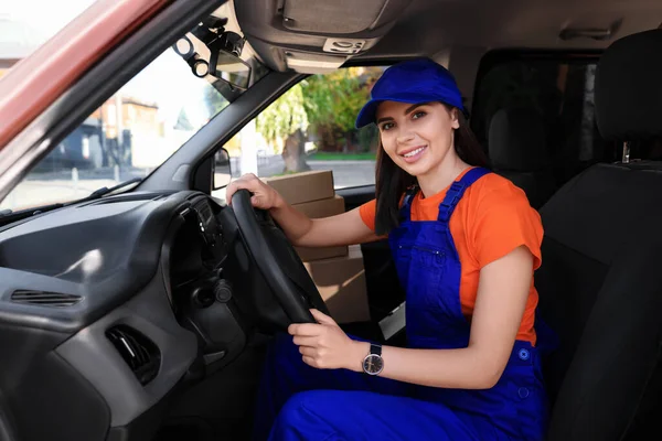 Courier wearing uniform in car. Delivery service