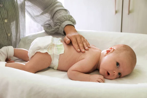 Mother Massaging Her Little Baby Changing Table Indoors Closeup — Stok Foto