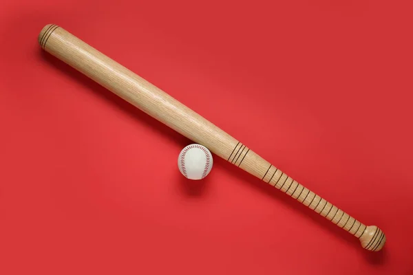 Wooden Baseball Bat Ball Red Background Flat Lay Sports Equipment — Zdjęcie stockowe