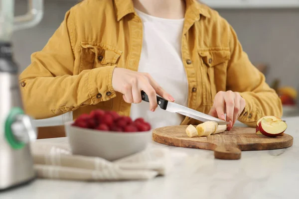 stock image Woman preparing ingredients for tasty smoothie at white marble table in kitchen, closeup