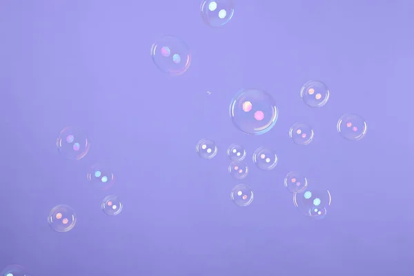 Many Beautiful Soap Bubbles Violet Background — Stockfoto