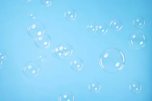 Many Beautiful Soap Bubbles Light Blue Background — Fotografia de Stock