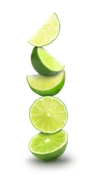 Many Stacked Cut Limes White Background — Stok fotoğraf