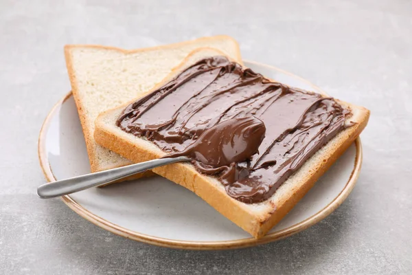 Tasty Breakfast Toast Chocolate Paste Served Grey Textured Table Closeup — Stock Photo, Image