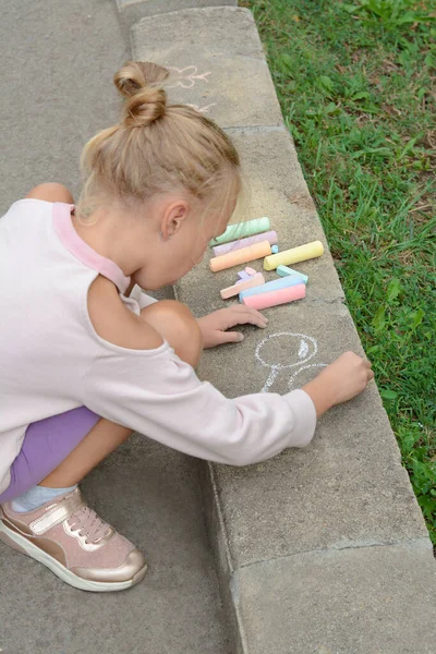 Little Child Drawing Balloons Chalk Asphalt — стоковое фото