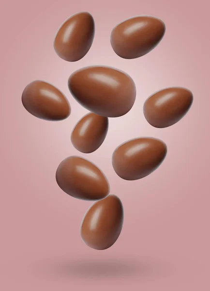 stock image Many chocolate eggs falling on dusty pink background