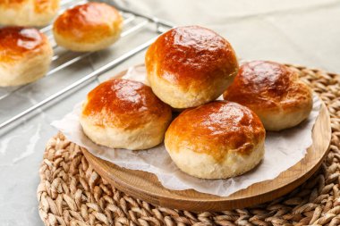 Tasty scones prepared on soda water on grey marble table clipart