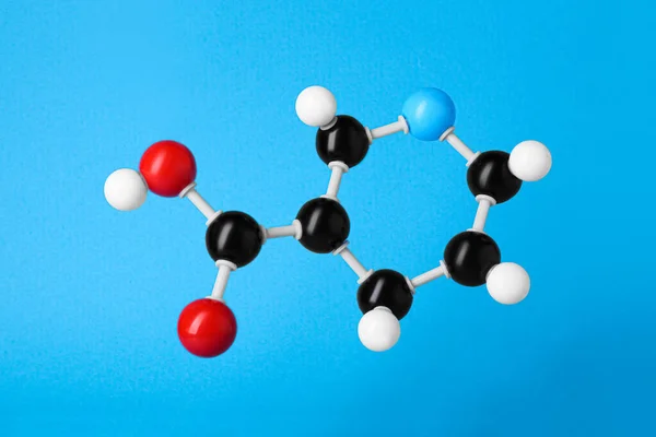水色の背景にビタミンB3の分子 化学モデル — ストック写真