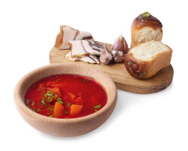 Delicious borsch served with pampushky and salo on white background. Traditional Ukrainian cuisine