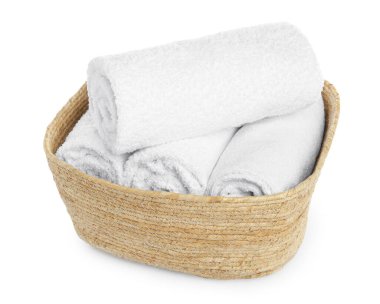 Wicker laundry basket with clean towels isolated on white