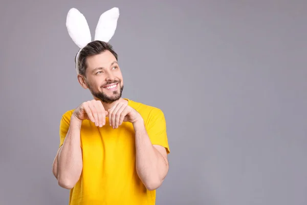 Happy Man Wearing Bunny Ears Headband Grey Background Space Text — Stock Photo, Image