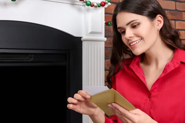 Young Woman Greeting Card Sitting Fireplace Indoors — Fotografia de Stock
