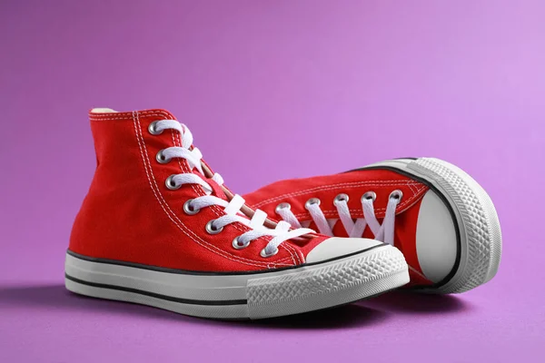 Pair New Stylish Red Sneakers Purple Background — Stock fotografie